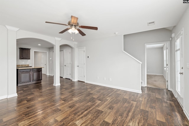 331 Aberlour Dr, Sumter, SC 29154 - unfurnished living room with ceiling fan, dark wood-style flooring, and arched walkways