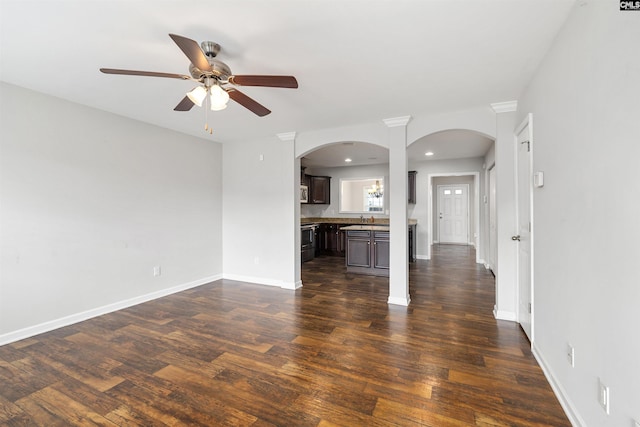 331 Aberlour Dr, Sumter, SC 29154 - unfurnished living room with arched walkways, a ceiling fan, dark wood-style floors, and recessed lighting