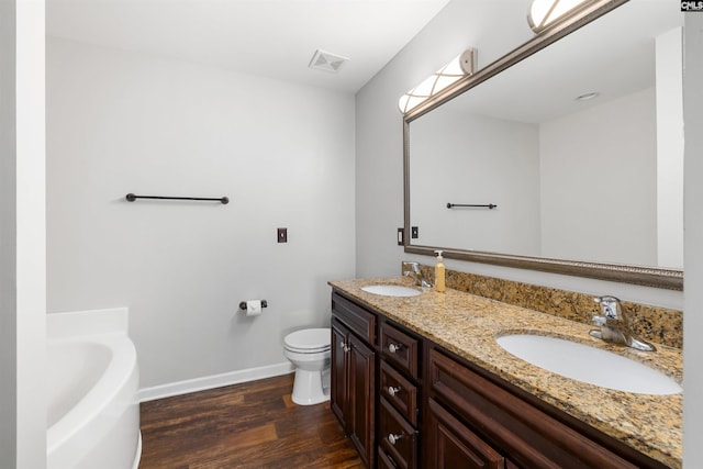 331 Aberlour Dr, Sumter, SC 29154 - bathroom featuring double vanity, wood finished floors, and a bath