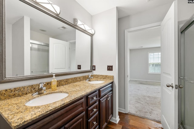 331 Aberlour Dr, Sumter, SC 29154 - full bathroom featuring a stall shower, double vanity, and wood finished floors