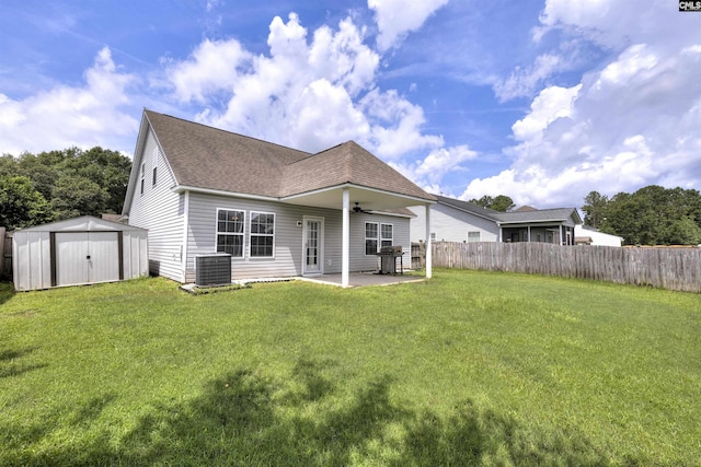 331 Aberlour Dr, Sumter, SC 29154 - back of house with a shingled roof, a fenced backyard, a patio area, a ceiling fan, and a shed