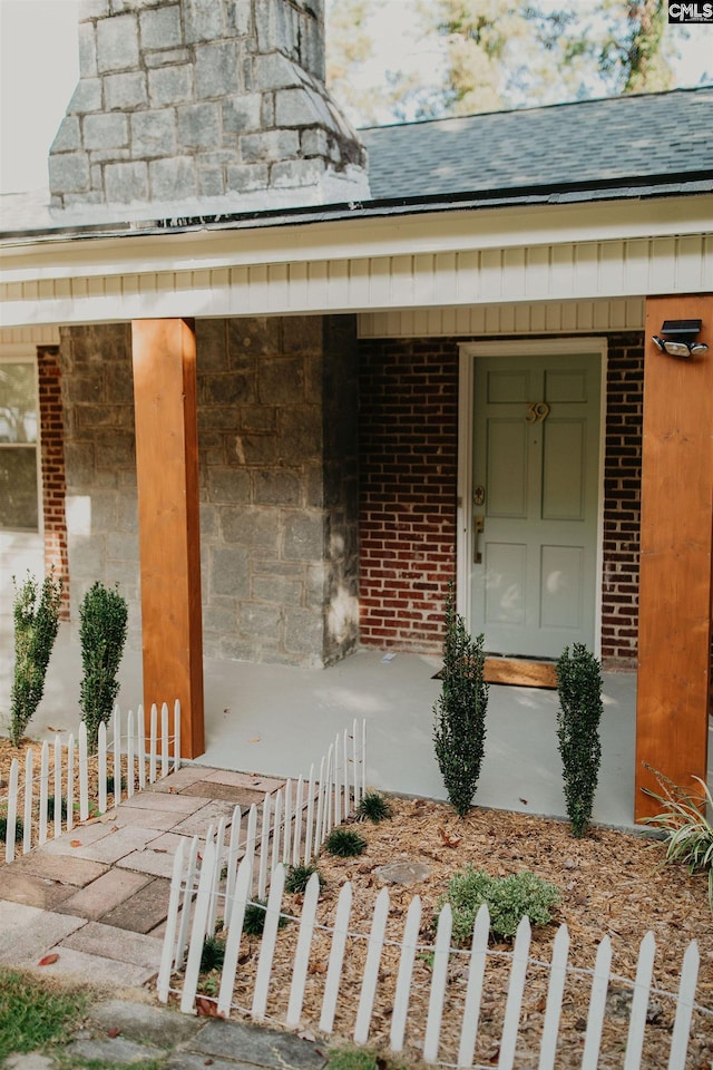 39 Downing, Columbia, SC 29209 - doorway to property with covered porch and a shingled roof