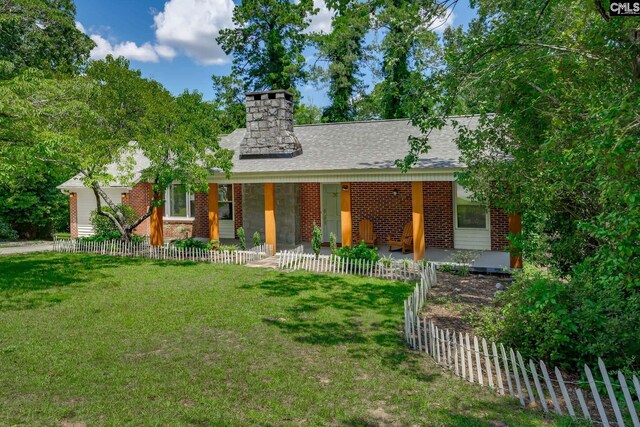 39 Downing, Columbia, SC 29209 - view of front of home featuring brick siding, a chimney, a shingled roof, and a porch