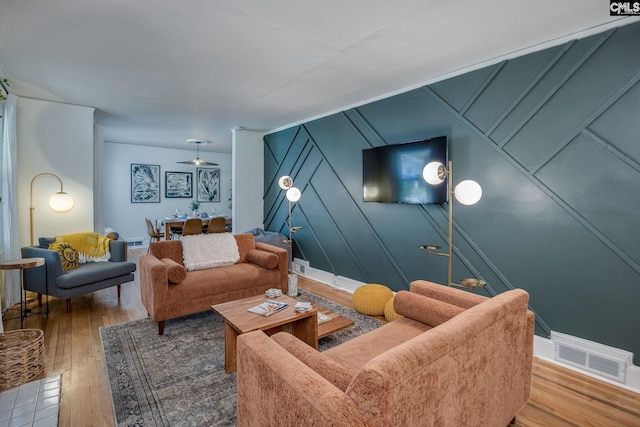 39 Downing, Columbia, SC 29209 - living area with wood-type flooring and a decorative wall
