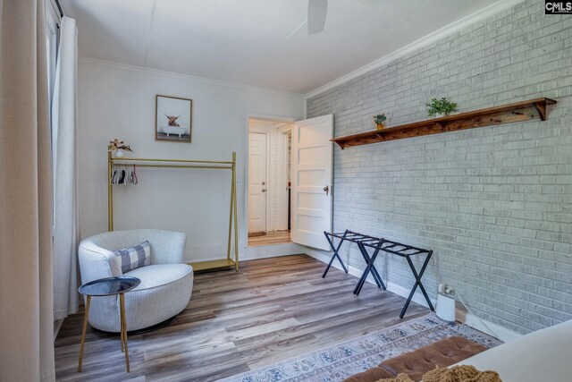 39 Downing, Columbia, SC 29209 - living area with brick wall, ornamental molding, wood finished floors, and a ceiling fan