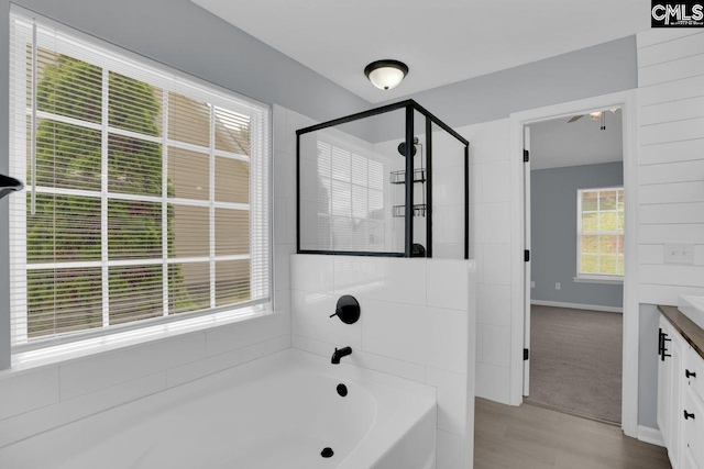 127 Waterville Dr, Columbia, SC 29229 - bathroom featuring a bath, healthy amount of natural light, vanity, and a stall shower
