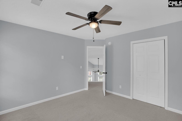 127 Waterville Dr, Columbia, SC 29229 - unfurnished bedroom with light carpet, a closet, and ceiling fan