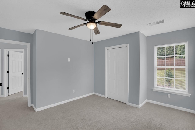 127 Waterville Dr, Columbia, SC 29229 - unfurnished bedroom featuring carpet flooring, ceiling fan, and a closet