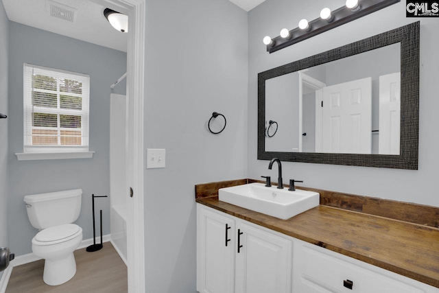 127 Waterville Dr, Columbia, SC 29229 - full bath featuring vanity, shower / bathtub combination, and wood finished floors