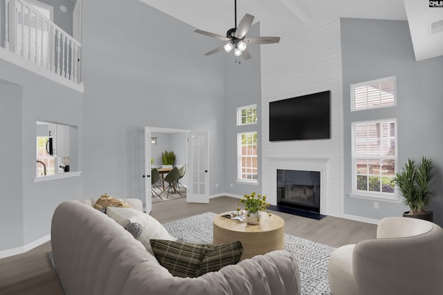 127 Waterville Dr, Columbia, SC 29229 - living area with high vaulted ceiling, wood finished floors, a ceiling fan, plenty of natural light, and a fireplace