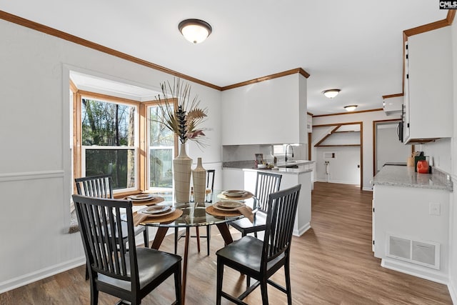 301 Colony Hill Rd, Lexington, SC 29072 - dining room with ornamental molding and light wood-type flooring