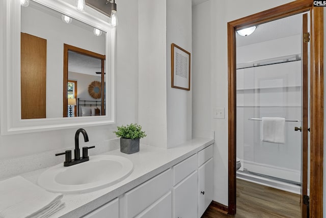 301 Colony Hill Rd, Lexington, SC 29072 - bathroom with a stall shower, vanity, and wood finished floors