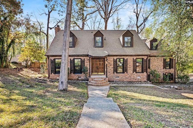 301 Colony Hill Rd, Lexington, SC 29072 - view of front of home with brick siding, a front yard, a chimney, and a shingled roof