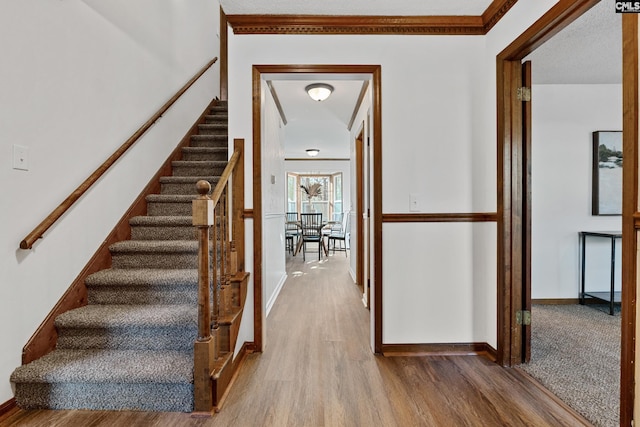 301 Colony Hill Rd, Lexington, SC 29072 - hallway featuring wood finished floors, stairs, and ornamental molding