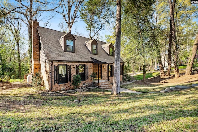 301 Colony Hill Rd, Lexington, SC 29072 - new england style home featuring brick siding, a chimney, a front yard, and a shingled roof