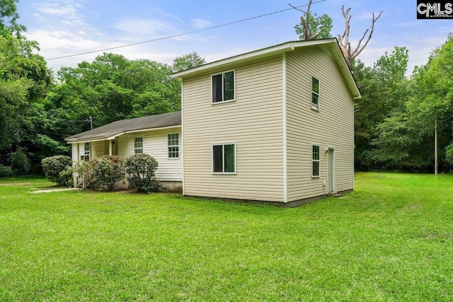 2027 Tucker Rd, Hopkins, SC 29061 - view of side of home featuring a lawn