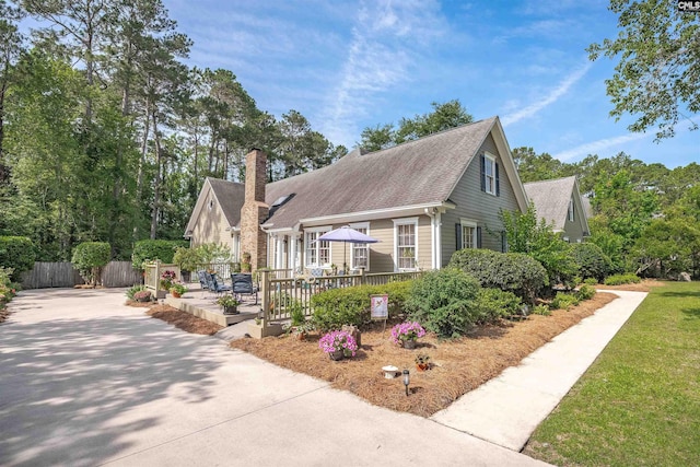 8 Sand Spur Rd, Columbia, SC 29223 - cape cod house with a chimney, a wooden deck, and a shingled roof