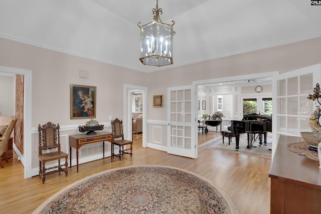 8 Sand Spur Rd, Columbia, SC 29223 - foyer featuring french doors, light wood-type flooring, crown molding, a chandelier, and vaulted ceiling