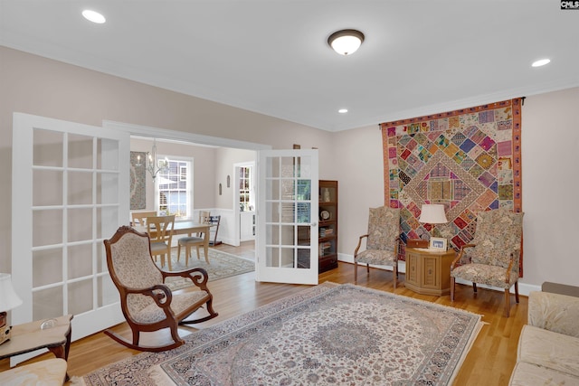 8 Sand Spur Rd, Columbia, SC 29223 - living area featuring ornamental molding, wood finished floors, a chandelier, french doors, and recessed lighting