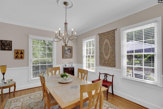 8 Sand Spur Rd, Columbia, SC 29223 - dining area with a chandelier, light wood-style floors, and ornamental molding