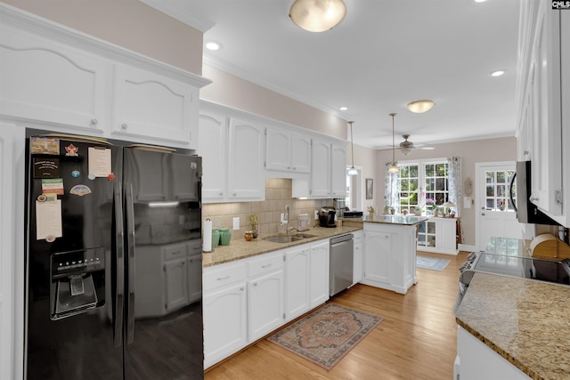 8 Sand Spur Rd, Columbia, SC 29223 - kitchen with appliances with stainless steel finishes, a peninsula, white cabinets, a ceiling fan, and ornamental molding
