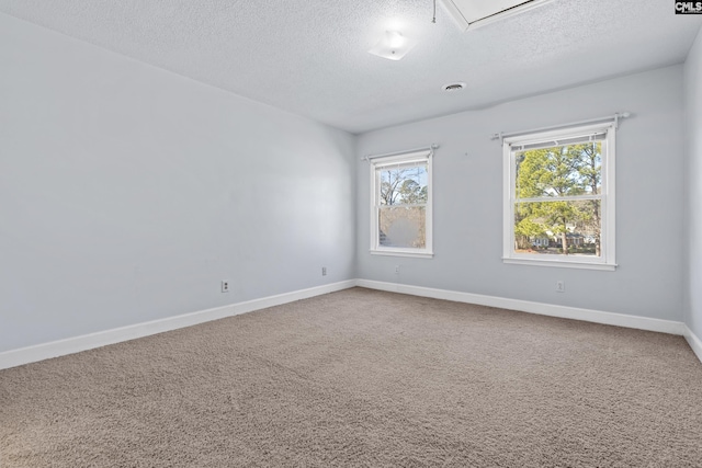 705 Kinlock Ct, Columbia, SC 29223 - carpeted spare room featuring a textured ceiling and attic access