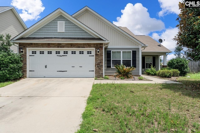 422 Drooping Leaf Rd, Lexington, SC 29072 - view of front of home featuring board and batten siding, an attached garage, concrete driveway, a front yard, and stone siding