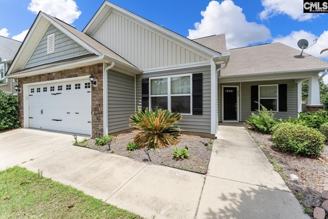 422 Drooping Leaf Rd, Lexington, SC 29072 - view of front of home with board and batten siding, driveway, stone siding, and a garage