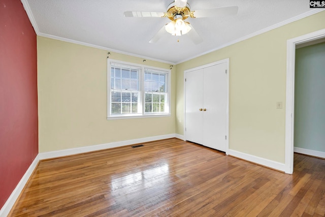 159 Rogers Rd, Saluda, SC 29138 - unfurnished bedroom featuring wood finished floors, a closet, ornamental molding, and ceiling fan