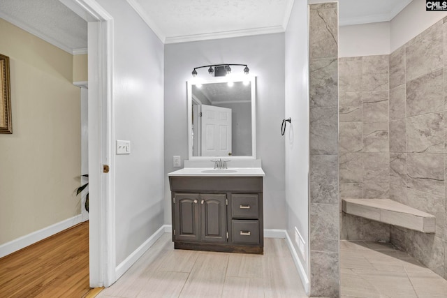 159 Rogers Rd, Saluda, SC 29138 - bathroom featuring vanity, ornamental molding, wood finished floors, and tiled shower