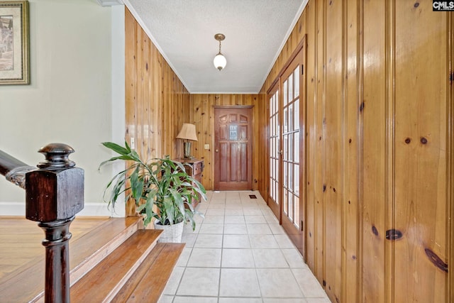 159 Rogers Rd, Saluda, SC 29138 - foyer with wooden walls, light tile patterned flooring, a textured ceiling, and crown molding