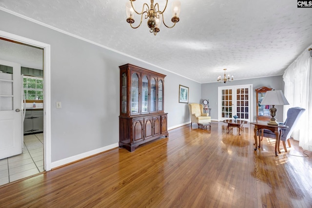 159 Rogers Rd, Saluda, SC 29138 - dining area featuring a chandelier, a textured ceiling, wood finished floors, and crown molding