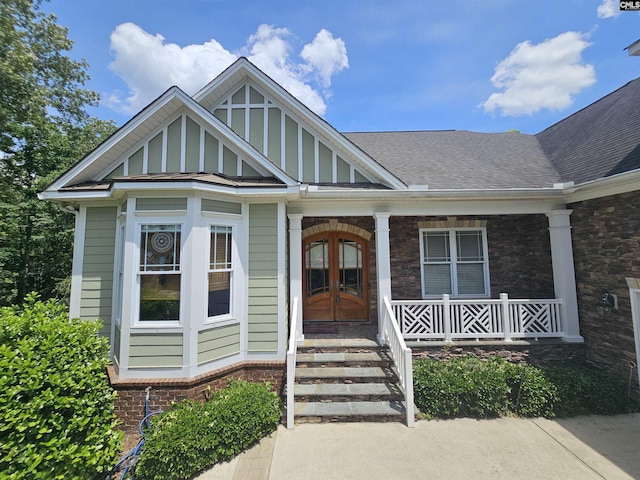 116 Avington Ln, Columbia, SC 29229 - view of front of home featuring french doors, covered porch, roof with shingles, and brick siding