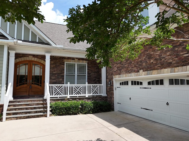 116 Avington Ln, Columbia, SC 29229 - doorway to property with roof with shingles, stone siding, concrete driveway, and french doors