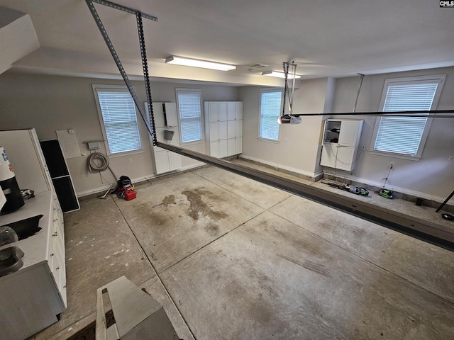 116 Avington Ln, Columbia, SC 29229 - garage featuring baseboards and a garage door opener