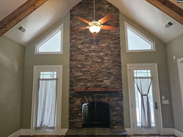 116 Avington Ln, Columbia, SC 29229 - unfurnished living room featuring high vaulted ceiling, a stone fireplace, beamed ceiling, ceiling fan, and plenty of natural light