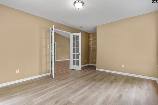 364 Elders Pond Cir, Columbia, SC 29229 - spare room with french doors, light wood-style flooring, and lofted ceiling