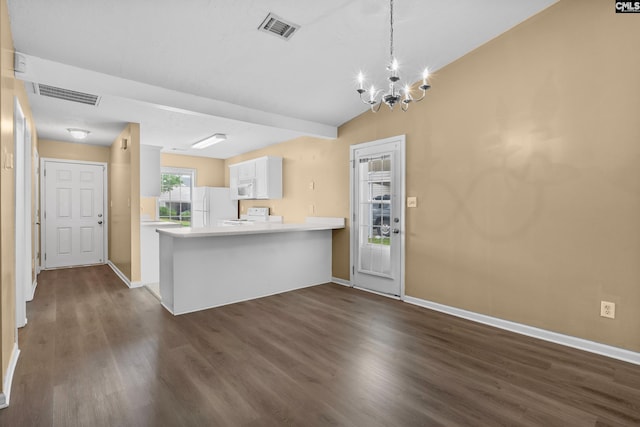 364 Elders Pond Cir, Columbia, SC 29229 - kitchen with white appliances, dark wood-style flooring, white cabinets, light countertops, and a chandelier