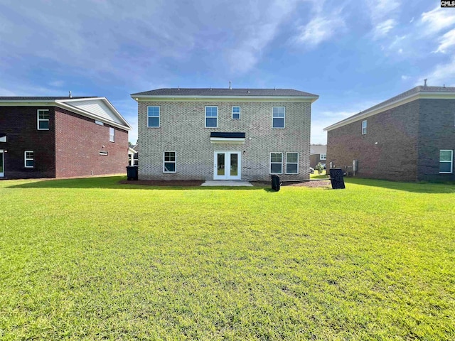 1958 Castlerock Dr, Sumter, SC 29153 - rear view of property featuring french doors, a lawn, and brick siding