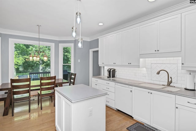 430 Hampton Creek Ct, Columbia, SC 29209 - kitchen with white dishwasher, light wood-style flooring, tasteful backsplash, light countertops, and white cabinets