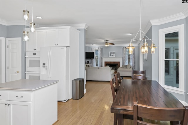 430 Hampton Creek Ct, Columbia, SC 29209 - dining area featuring a ceiling fan, light wood-style floors, a fireplace, ornamental molding, and recessed lighting