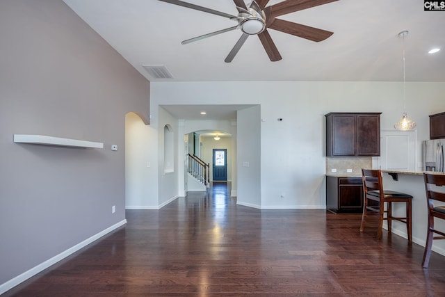22 Kentucky Derby Ct, Lugoff, SC 29078 - living room featuring arched walkways, a ceiling fan, dark wood-style floors, stairs, and recessed lighting
