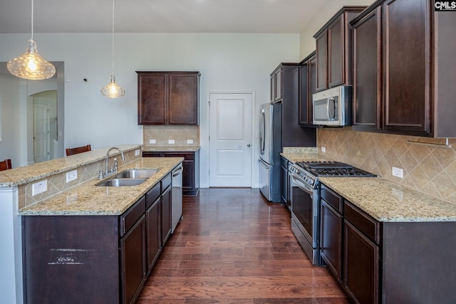 22 Kentucky Derby Ct, Lugoff, SC 29078 - kitchen featuring stainless steel appliances, dark wood finished floors, dark brown cabinets, and backsplash
