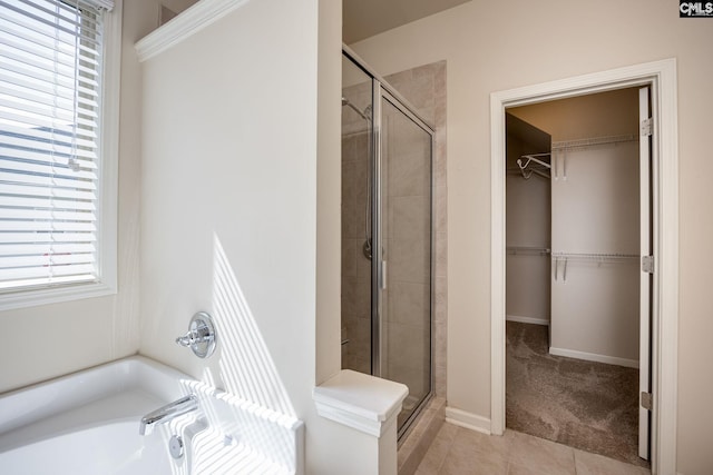 22 Kentucky Derby Ct, Lugoff, SC 29078 - full bath with a shower stall, a bath, a walk in closet, and tile patterned floors