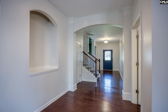 22 Kentucky Derby Ct, Lugoff, SC 29078 - foyer with wood finished floors, stairway, and arched walkways