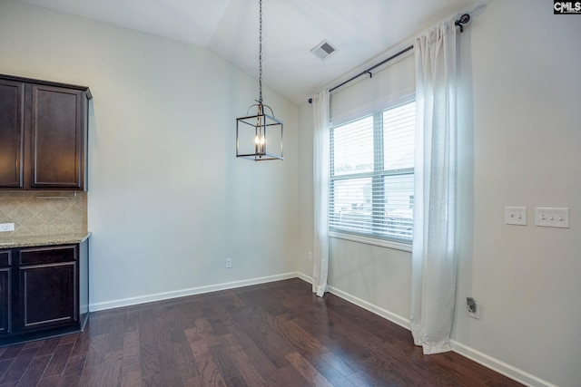 22 Kentucky Derby Ct, Lugoff, SC 29078 - unfurnished dining area featuring dark wood-type flooring and vaulted ceiling