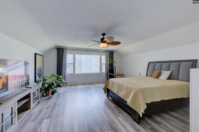 241 Friarsgate Blvd, Irmo, SC 29063 - bedroom featuring vaulted ceiling, wood finished floors, a textured ceiling, and ceiling fan