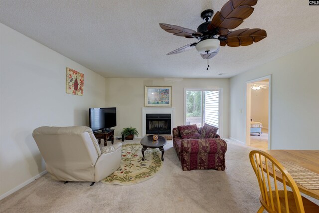 241 Friarsgate Blvd, Irmo, SC 29063 - living area featuring a textured ceiling, ceiling fan, carpet floors, and a fireplace