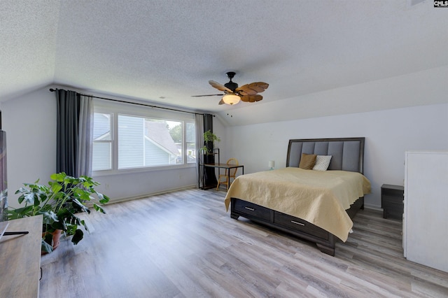 241 Friarsgate Blvd, Irmo, SC 29063 - bedroom with vaulted ceiling, light wood finished floors, a textured ceiling, and ceiling fan