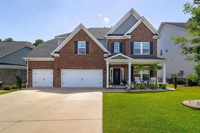 214 Chapin Brook Ct, Chapin, SC 29036 - craftsman-style home featuring brick siding, covered porch, driveway, a front yard, and roof with shingles